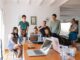 group of people watching on laptop